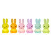 Set of six colorful rabbit-shaped night lights on a white background