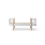 Oliver Furniture Wood Original Junior Bed in white and oak features Scandinavian design with curved corners, a slatted base for a 90x160cm mattress, and convertible extension options for growing children.