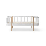 Oliver Furniture Wood Original Junior Day Bed in white and oak, designed with curved corners and serving as both a cozy bed and inviting sofa. 
