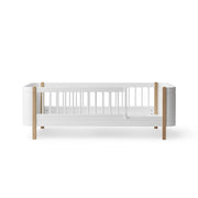 Oliver Furniture Wood Mini+ Junior Bed in white and oak, designed for a small child's bedroom, offering a cosy sleeping space that can later transform into a daybed. 