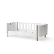 Oliver Furniture Wood Mini+ Junior Bed in white and oak, designed as a cosy and practical sleeping space for small children, featuring a low profile and the option to convert into a daybed. 