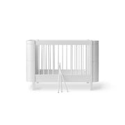 Oliver Furniture Wood Mini+ Cot Bed with Junior Kit in white, a convertible baby bed for ages 0-9 years made from solid birch wood with adjustable mattress height and removable bars.