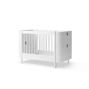 Oliver Furniture Wood Mini+ Cot Bed with Junior Kit in white, a convertible birch wood crib that transforms from newborn cot to junior bed for children 0-9 years.