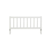 White solid birchwood bed guard safety rail for Oliver Furniture Wood Original beds with vertical spindles and secure mounting hardware.