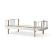 Oliver Furniture Wood Original Bed in white and oak features Scandinavian design with curved corners, a slatted base, and wooden posts suitable for older children and teenagers.