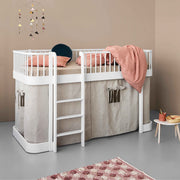 White Oliver Furniture Wood Original Low Loft Bed with integrated storage space, ladder, and curved design for children ages 6+, featuring birchwood construction and a versatile under-bed play area.