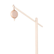 Wooden baby mobile with hanging ball on a white background