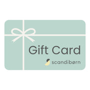Scandibørn digital gift card with mint green background and white ribbon bow, perfect for purchasing toys, clothing, nursery accessories, and home décor items online.
