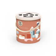 Toy packaging with illustrations of a house and geometric shapes on a white background