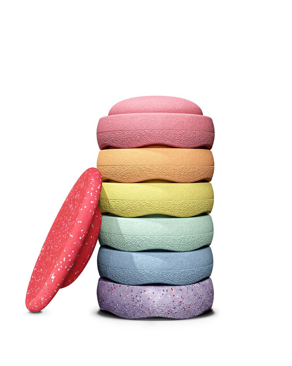A stack of six textured, stapelstein stepping stones in pastel colours, with one red speckled wobble board leaning against the left side, photographed on a clean white background.