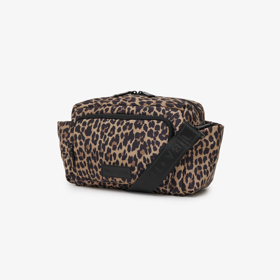 A leopard print waist bag with a black strap, shown on a plain light gray background.