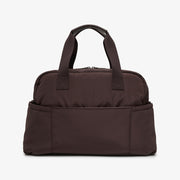 A dark brown nylon duffel bag with two top handles and a front slip pocket, shown against a plain white background.