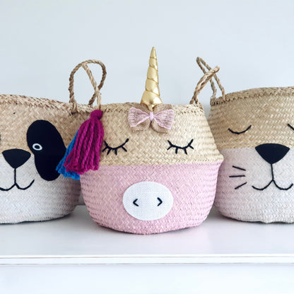 Three decorative baskets shaped like a panda, unicorn, and cat on a white background