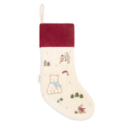 A Christmas stocking with a cream-colored body featuring embroidered polar bear, owls, and trees, a dark red velvet cuff, and a hanging loop at the top.
