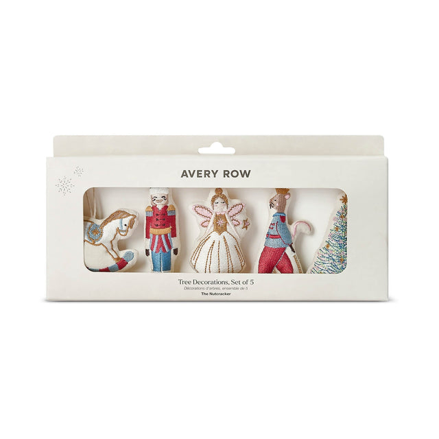 Avery Row Christmas tree decoration set of 5 in its original white window box packaging, featuring a nutcracker, sugar plum fairy, rocking horse, rat king and a Christmas tree ornament.
