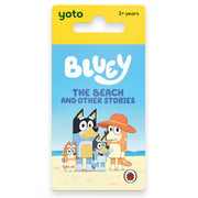 Yoto Bluey The Beach and Other Stories card book in its original yellow and blue hanging card packaging, featuring the Bluey characters on a sandy beach.