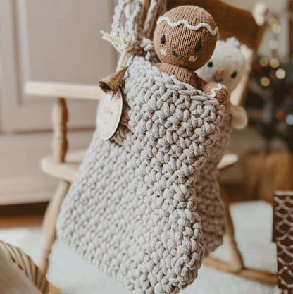 Crocheted Christmas stocking with a knitted gingerbread man inside