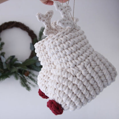 White crochet reindeer ornaments with red noses on a white background
