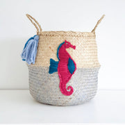 Woven basket with embroidered seahorse design on a white background
