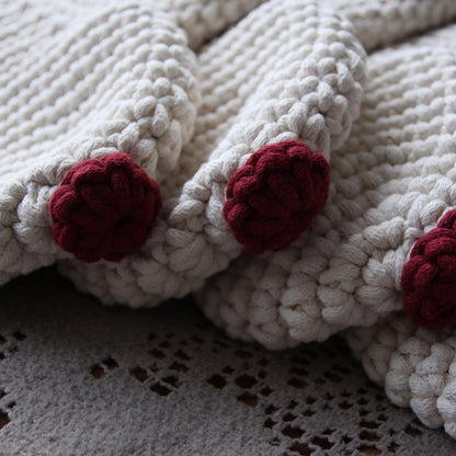 White crocheted Christmas stockings with red noses