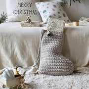 Cosy living room with a crochet Christmas stocking and Christmas decor