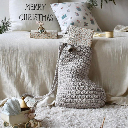 Cosy living room with a crochet Christmas stocking and Christmas decor