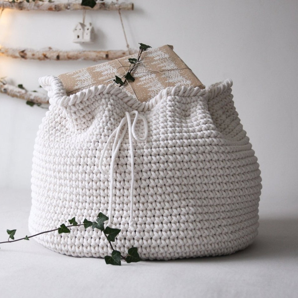 White present sack on a light background with decorative elements