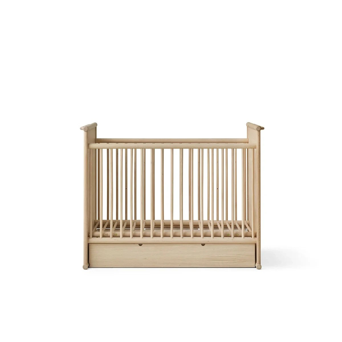 A light natural wood baby crib with vertical slats and a built-in storage drawer at the bottom, shown against a plain white background.