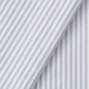 Oliver Furniture Seaside Classic Bed Curtain in blue and white striped certified cotton, shown with a folded section to highlight fabric detail, creating a cozy den-like atmosphere for children. 