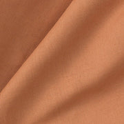 Close-up of a rust-colored Oliver Furniture Seaside Classic Bed Curtain made of certified cotton, machine washable at 30C, featuring a visible weave and soft folds. 