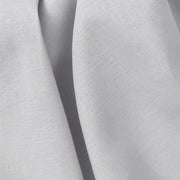 Close-up of a grey Oliver Furniture Seaside Classic Bed Curtain showcasing its textured fabric and folded design. 