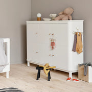 Modern Scandinavian white wooden 3-door cupboard with soft-close doors, leather handles, hanging rail, and adjustable shelves designed for children's storage and clothing organization.