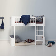 White Oliver Furniture Wood Mini+ Low Loft Bed with right-side ladder, curved birch frame, and spacious under-bed play area, ideal for children ages 6+ in small rooms.