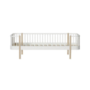 Oliver Furniture Wood Original Day Bed in white and oak finish, a versatile and stylish Scandinavian-inspired piece perfect for a summer house, guest room, or teenager's retreat. 