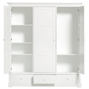 White three-door wardrobe with adjustable shelves, full-height hanging space, drawers, and soft-close hinges from Oliver Furniture Seaside Collection.