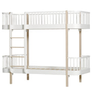 Oliver Furniture Wood Original white and oak bunk bed with left-side ladder and curved safety railings, designed for siblings and convertible into two separate beds.