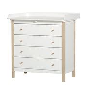White and oak wood nursery dresser with four soft-close drawers and removable changing table top by Oliver Furniture.
