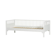 White Oliver Furniture Seaside Classic day bed with Nordic design, vertical spindle railings, and wooden slat base, ideal as a kids bed, guest bed, or living room sofa.